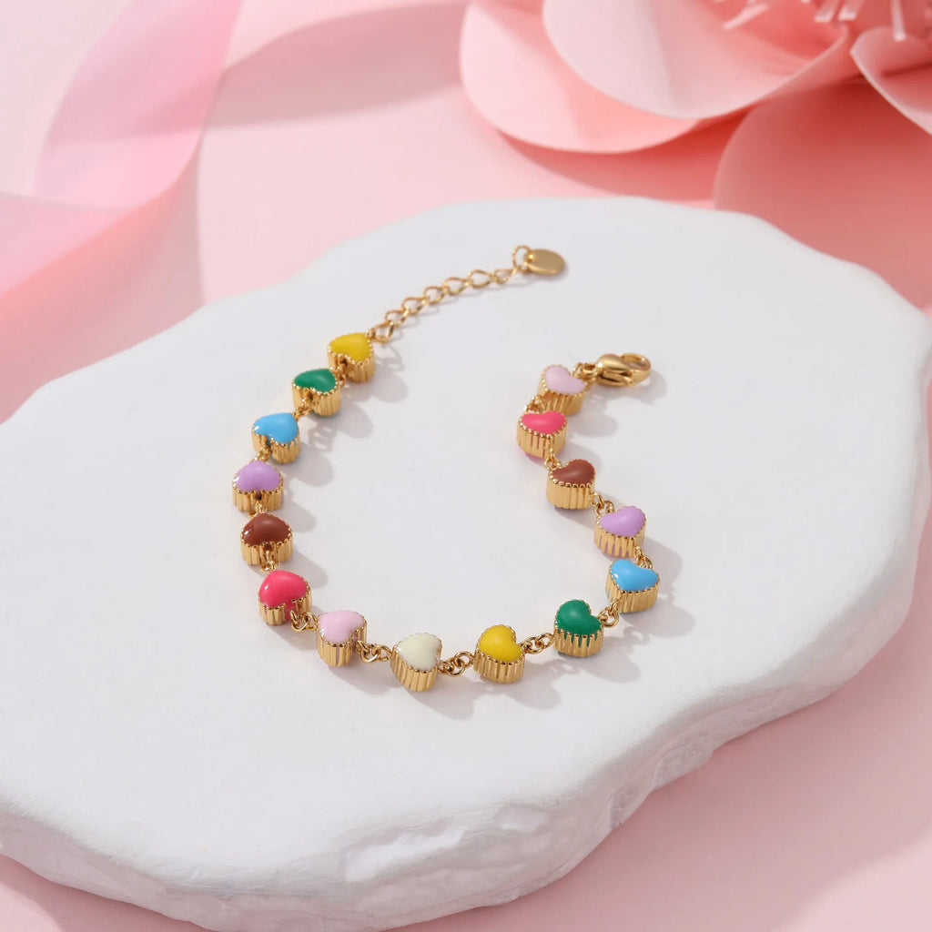 Heart-shaped titanium steel bracelet with colourful oil elements in gold or steel colour options