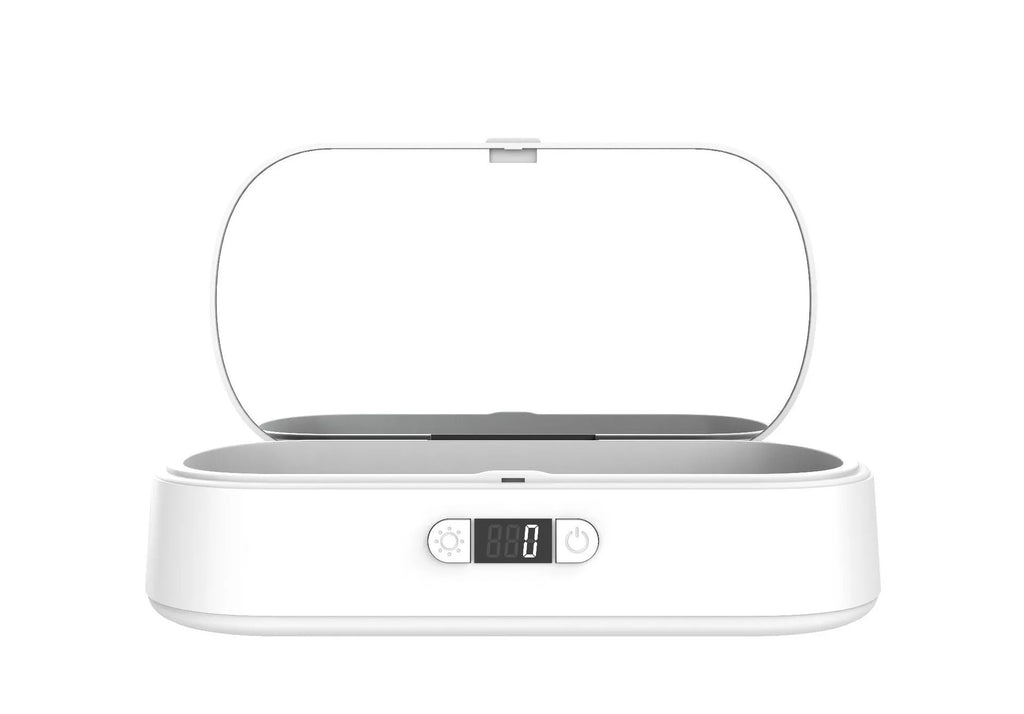White ABS UV steriliser box with wireless charging for phones and jewellery on a plain background.