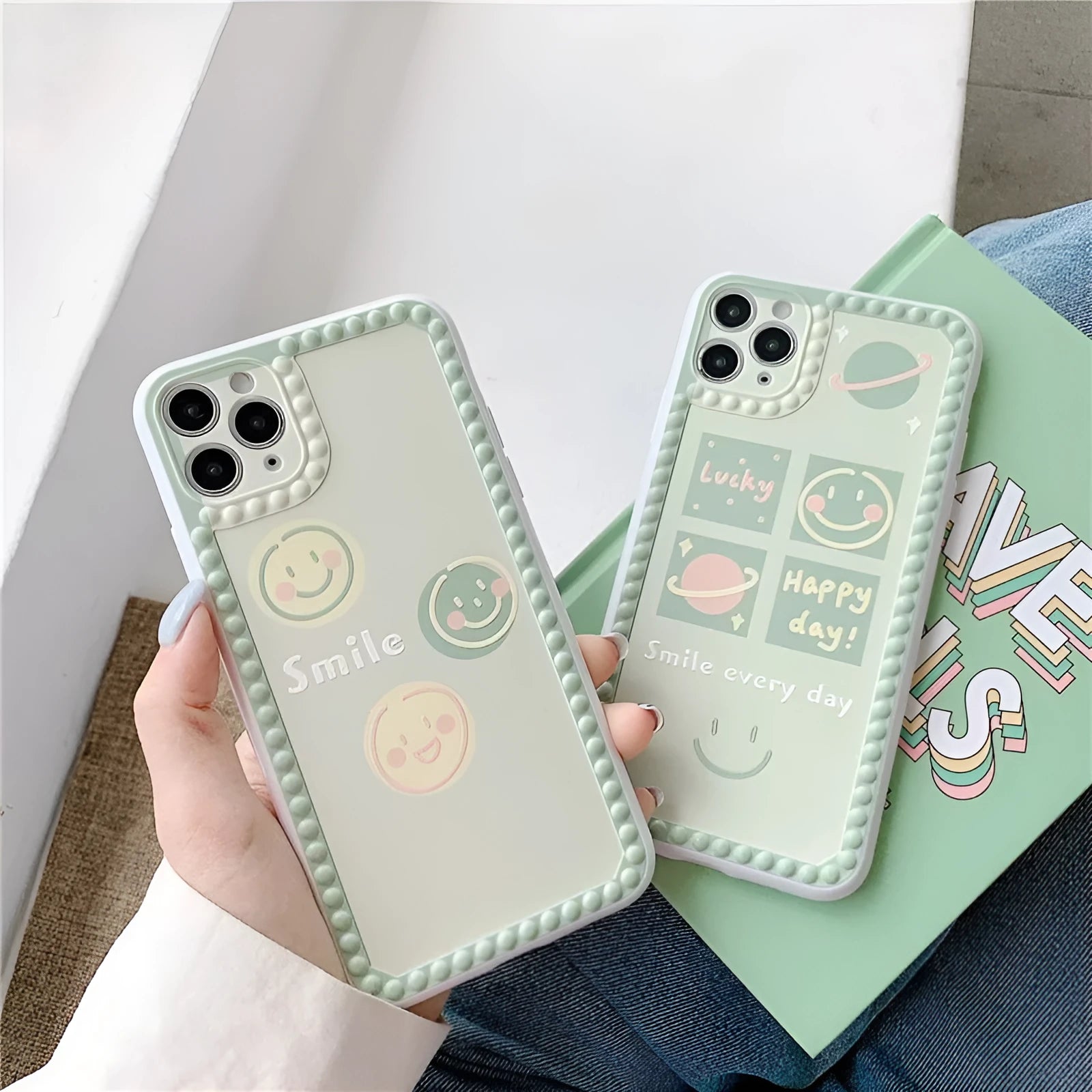 Green iPhone case with geometric shapes and smiley face pattern, TPU back cover.