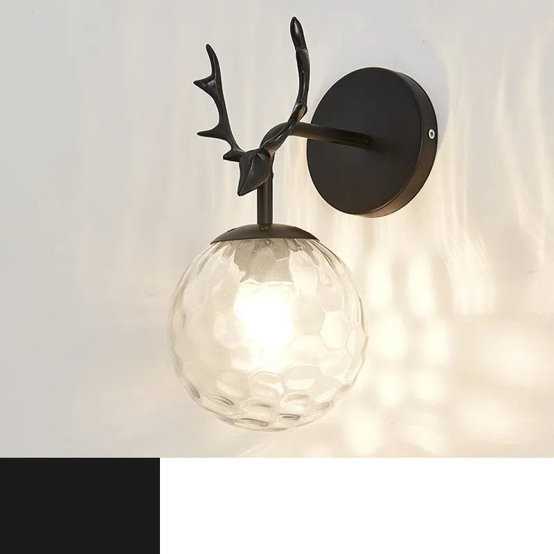 Modern round glass wall lamp with Nordic minimalist design on a wall.
