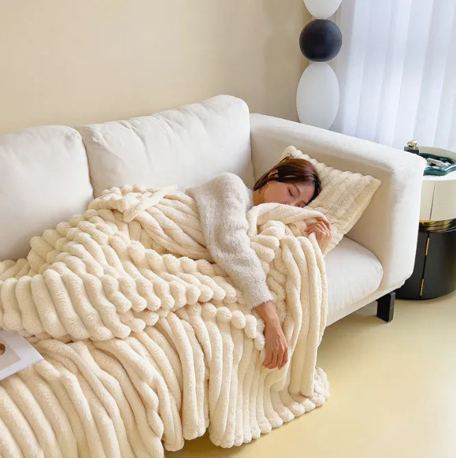 Soft Wind double-sided thickening bubble velvet blanket in a solid colour shown on a sofa.