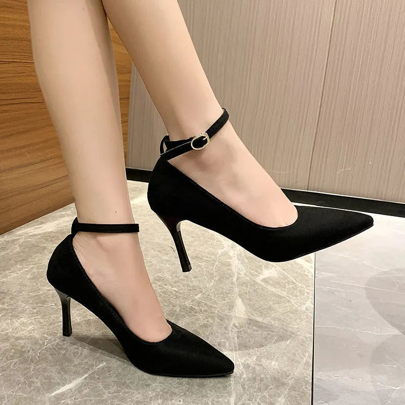 Women's black stiletto pump shoes with skull pattern and buckle detail on 8cm heel