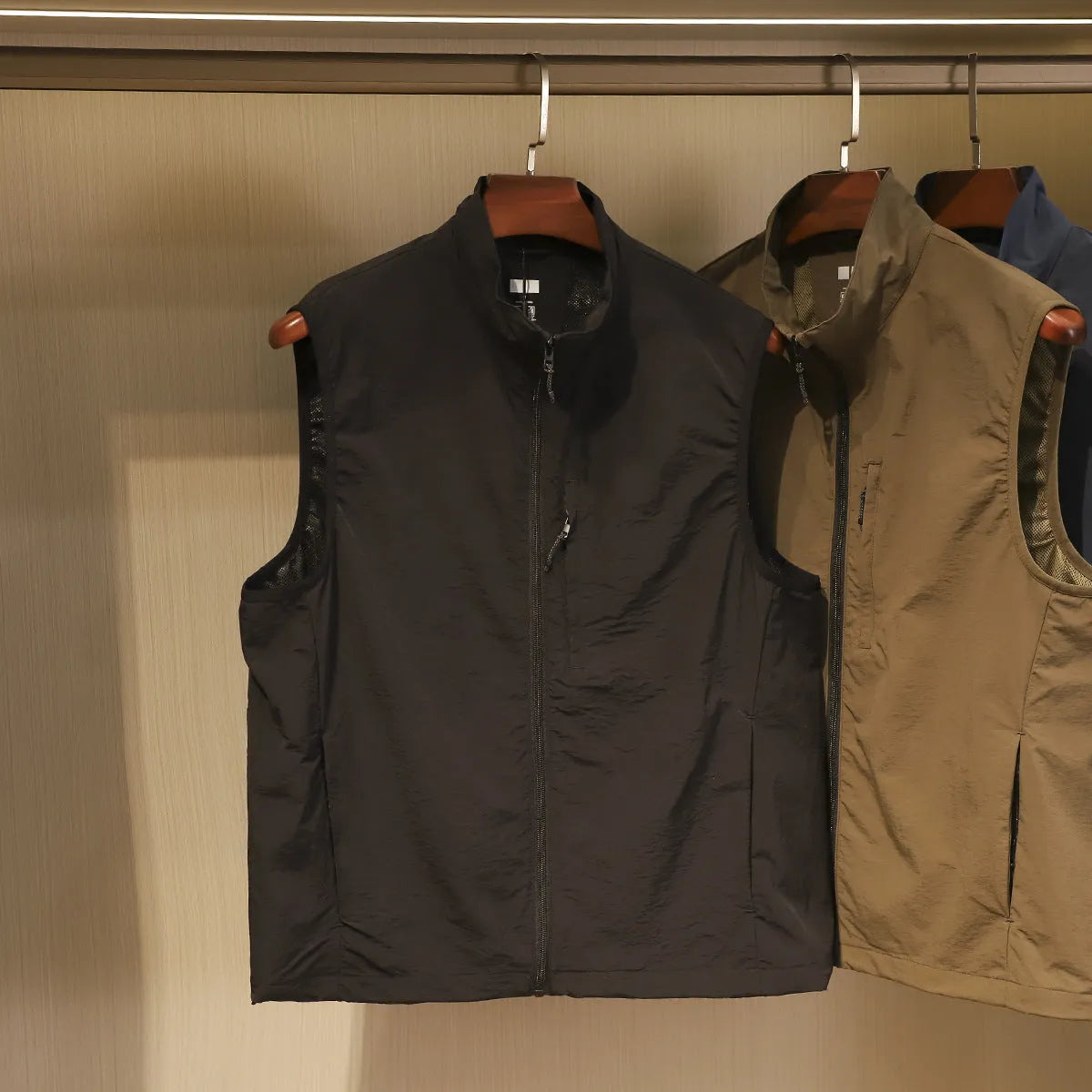 Men's thin nylon vest cardigan in army green with side pockets and straight retro cut.