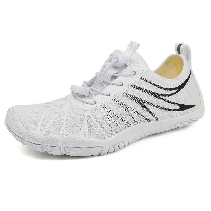 Low-top unisex casual sports running shoe in multiple colours with a lace-up front and rubber sole.