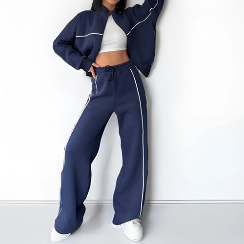 Casual two-piece suit set with a grey hoodie and striped lace-up trousers on a hanger