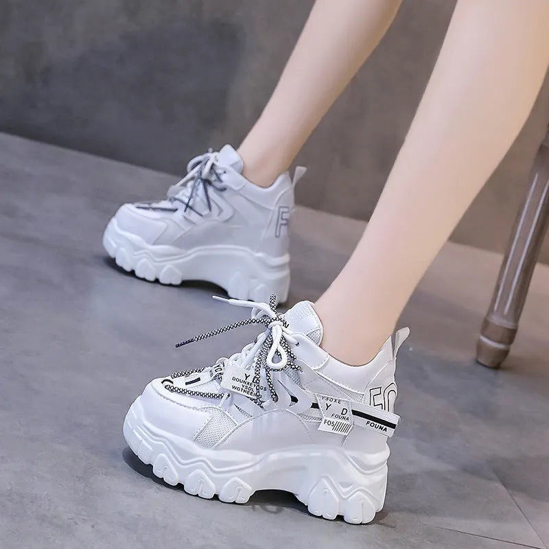 White women's platform tennis shoes with mesh upper and cross strap design