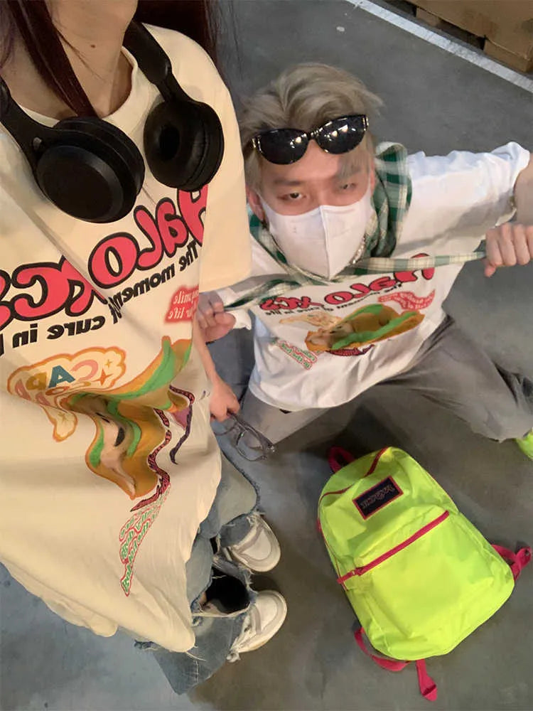Loose fit white cotton T-shirt with a cartoon hamburger dog print on the front.