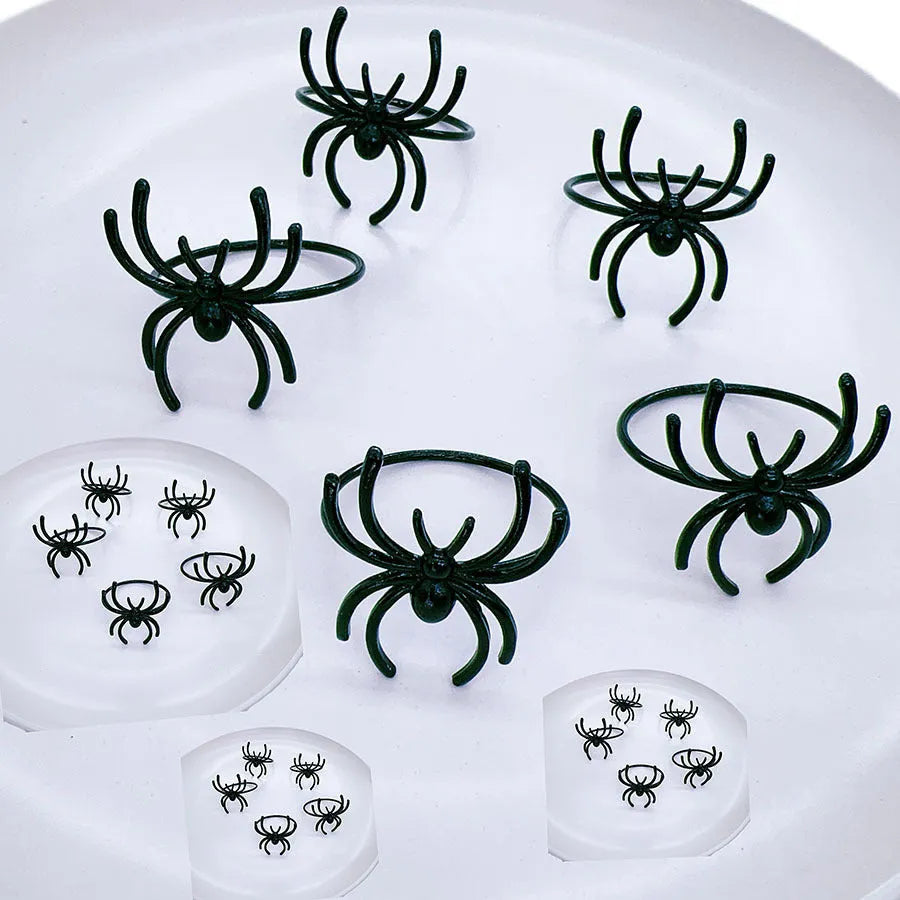 Six black alloy spider design napkin rings for Halloween table settings
