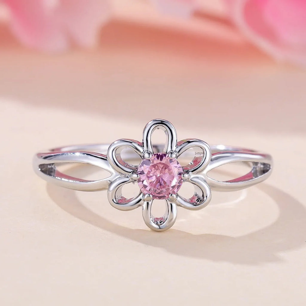 Copper flower hollow-out fashion ring for women with platinum pink diamond plating.