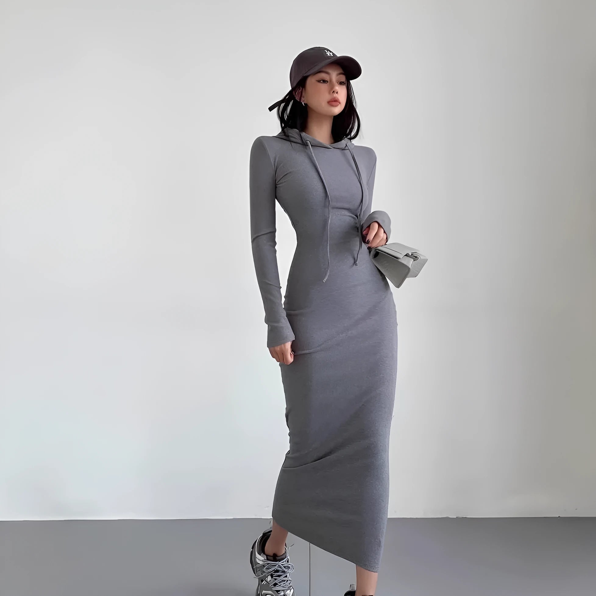 Women's grey hooded long sleeve sheath dress with high waist on a mannequin.