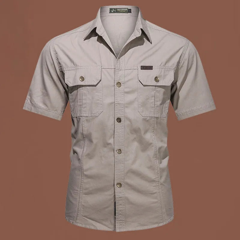 Men's loose fit cotton short sleeve work shirt in cardigan style on a hanger