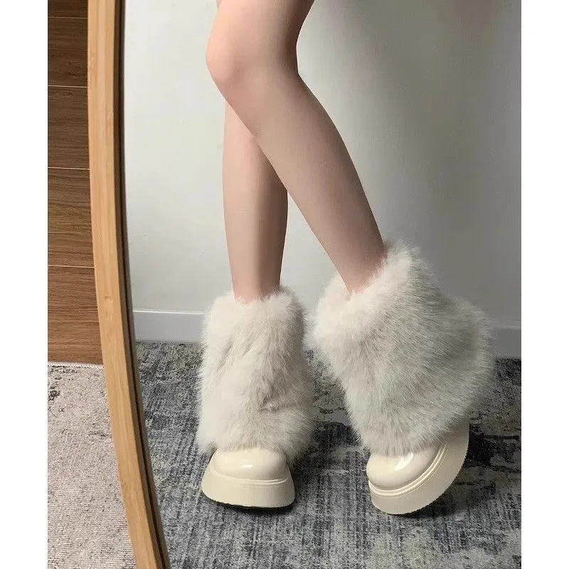 Women's black artificial plush snow boots with a round toe, low-top design, and a mid rubber sole.