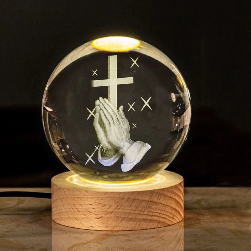 White crystal lamp with 6cm diameter orb on solid wood warm light base showing religious ornamentation