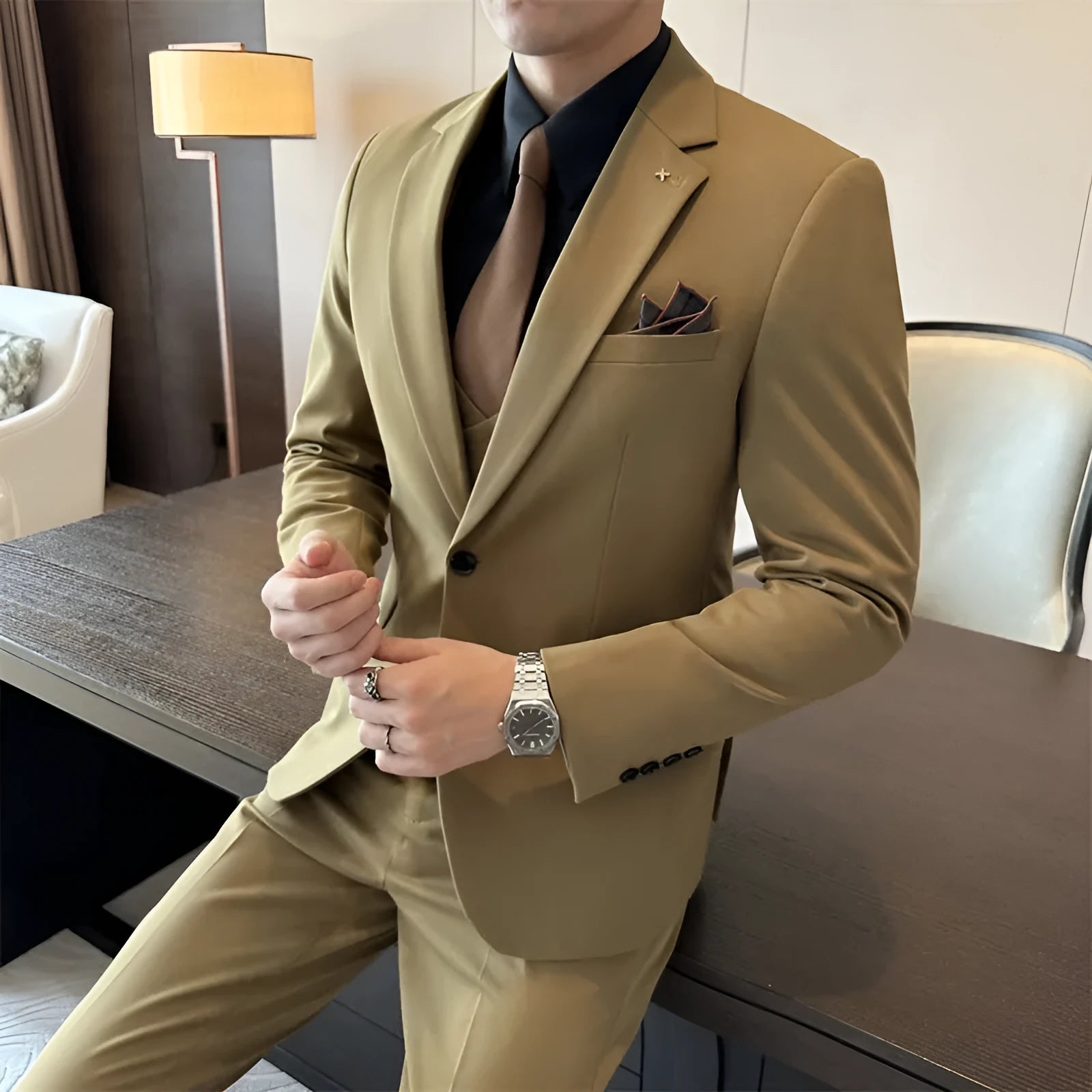 Men's slim fit business suit in a dark green viscose-blend fabric on a hanger.