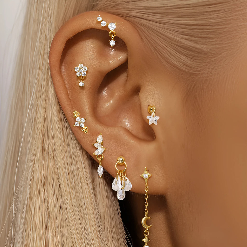 S925 sterling silver geometric star earrings with embedded moon and diamond detail in a gold colour.