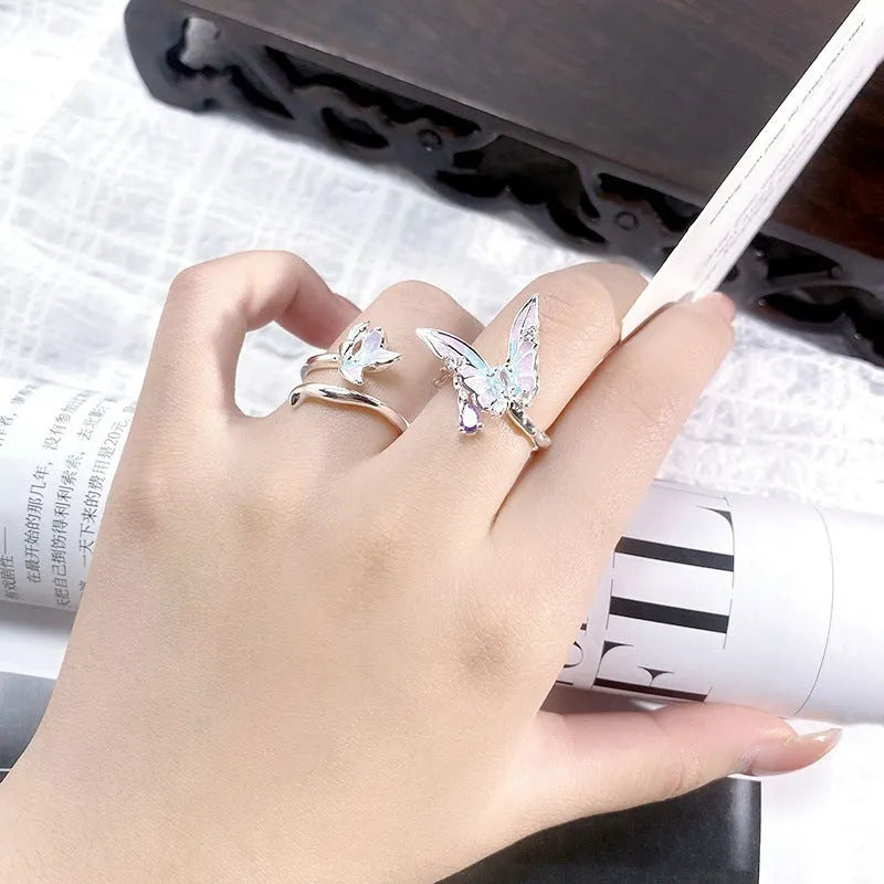 Copper adjustable insect ring on a finger, showing its irregular design and adjustable opening.