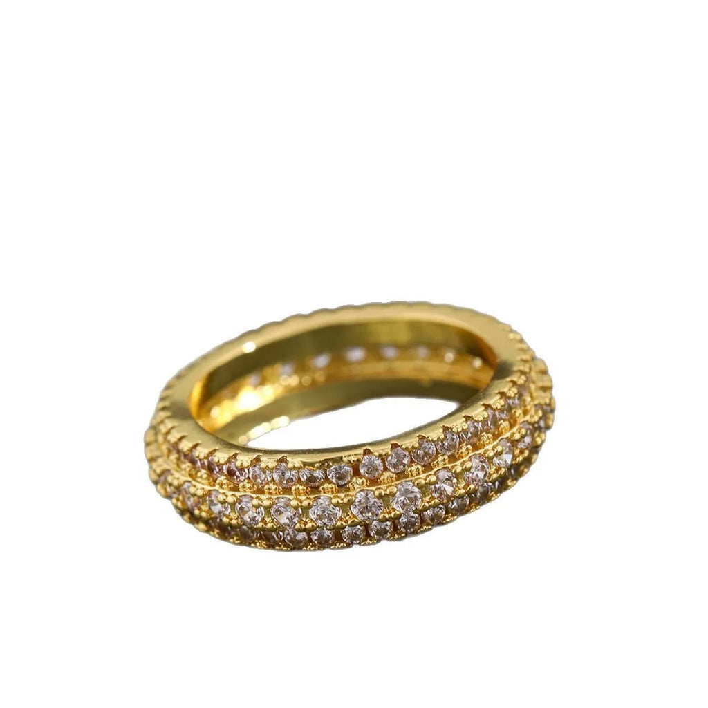Geometric copper ring with triangular zircon stone, shown in white gold, yellow gold, and white and black finish options.