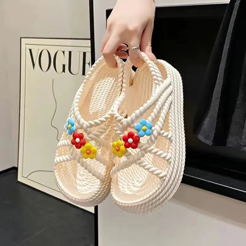 Beige women's round-toe sandals with sunflower pattern and non-slip PVC sole.