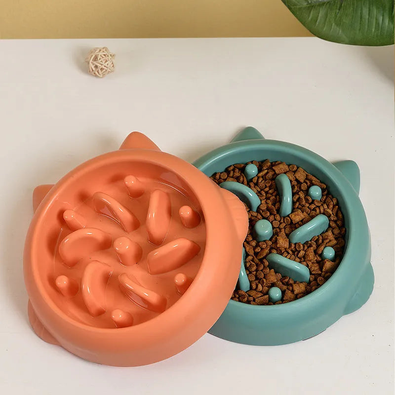 Green slow feeder dog bowl with raised bone-shaped ridges inside