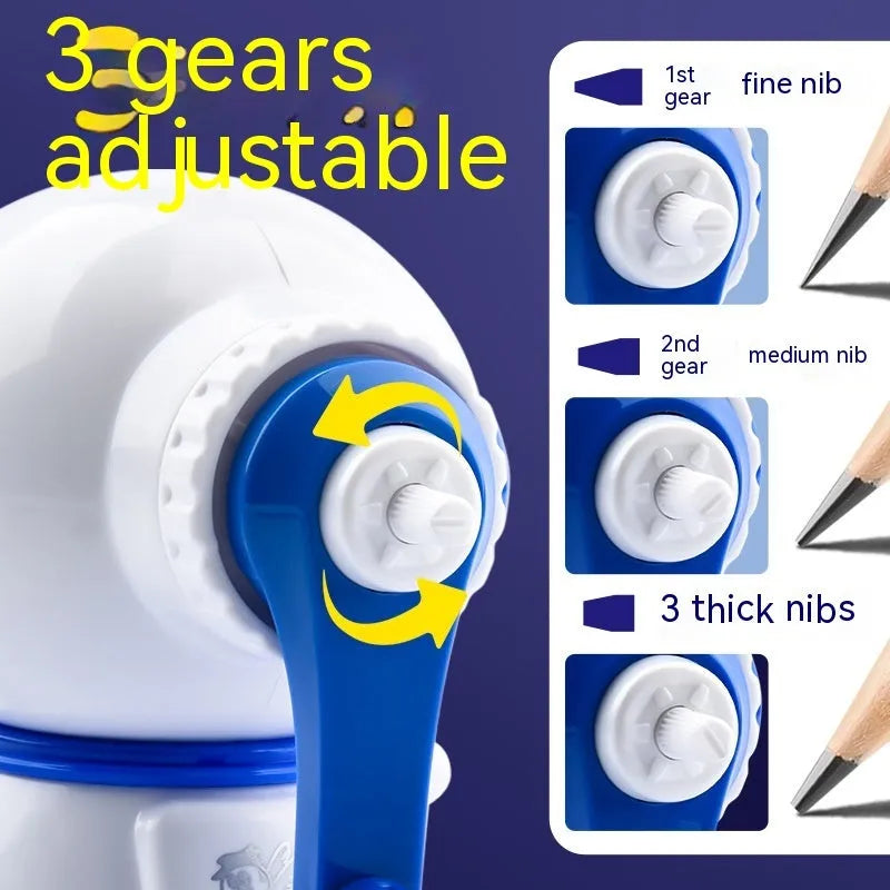 Blue and pink cartoon astronaut model manual pencil sharpener for children on a desk.