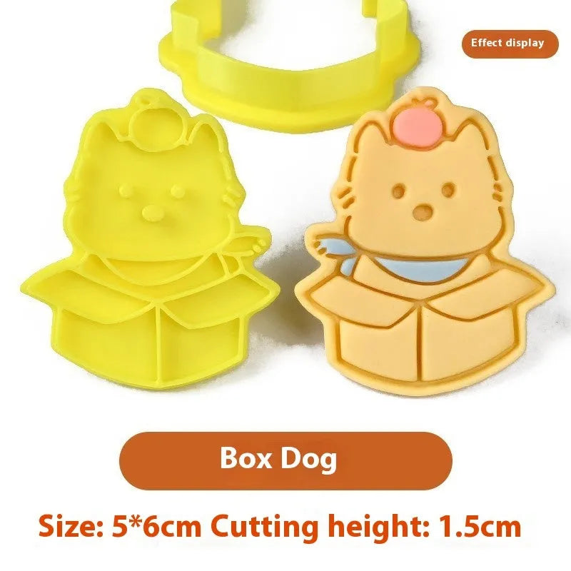 Three dimensional plastic biscuit mould showing puppy cartoon designs including birthday hats and swimming rings