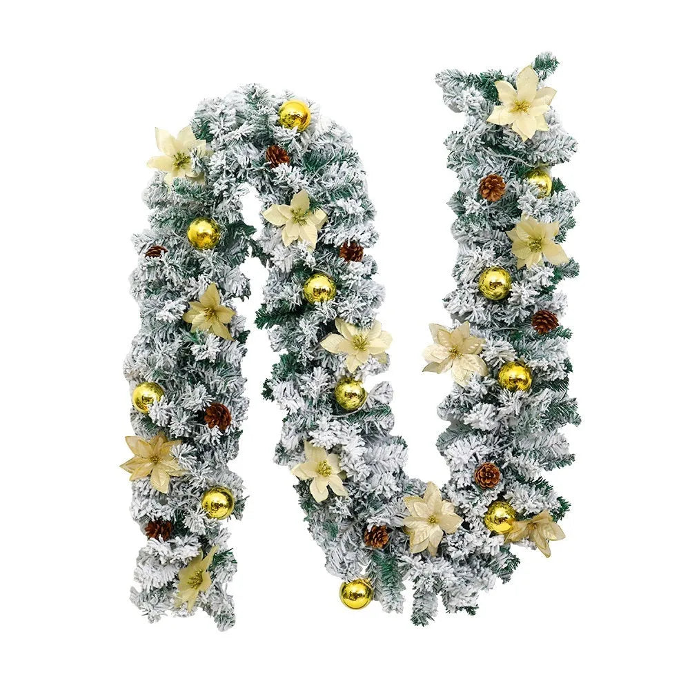 Snow-flocked Christmas rattan garland vine in red, draped on a mantelpiece.