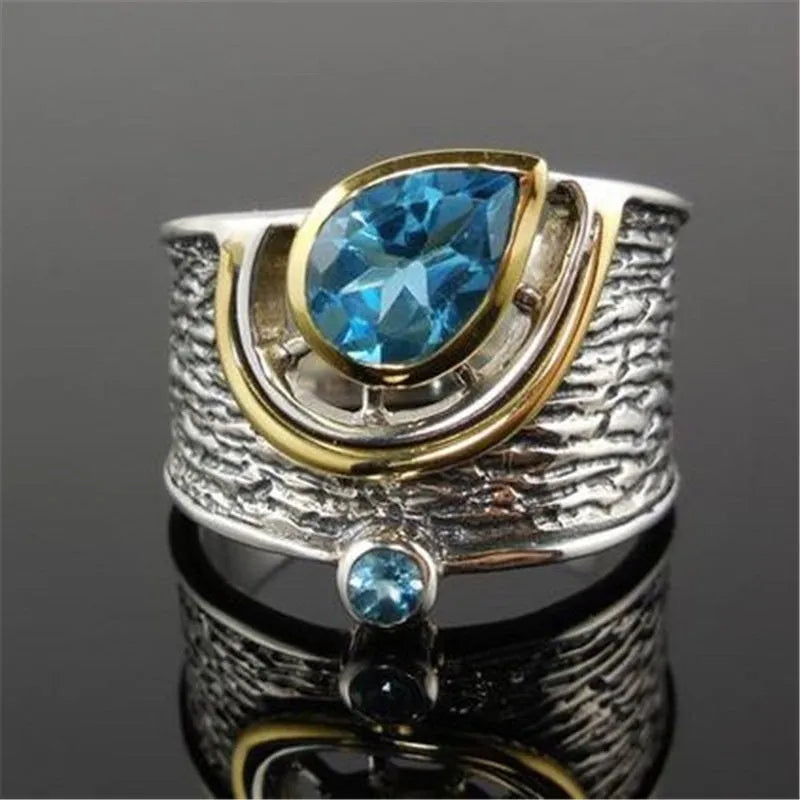 Chinese style women's blue zircon ring with drop shape design and inlaid detailing