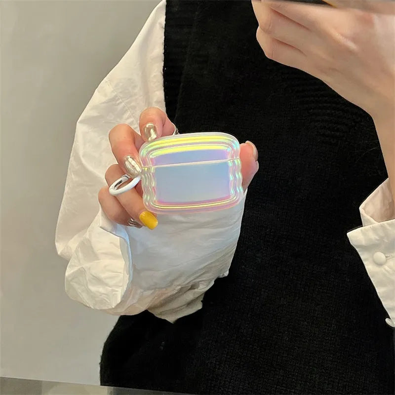 Silicone case for AirPods with a holographic magic laser ring design on a white background.