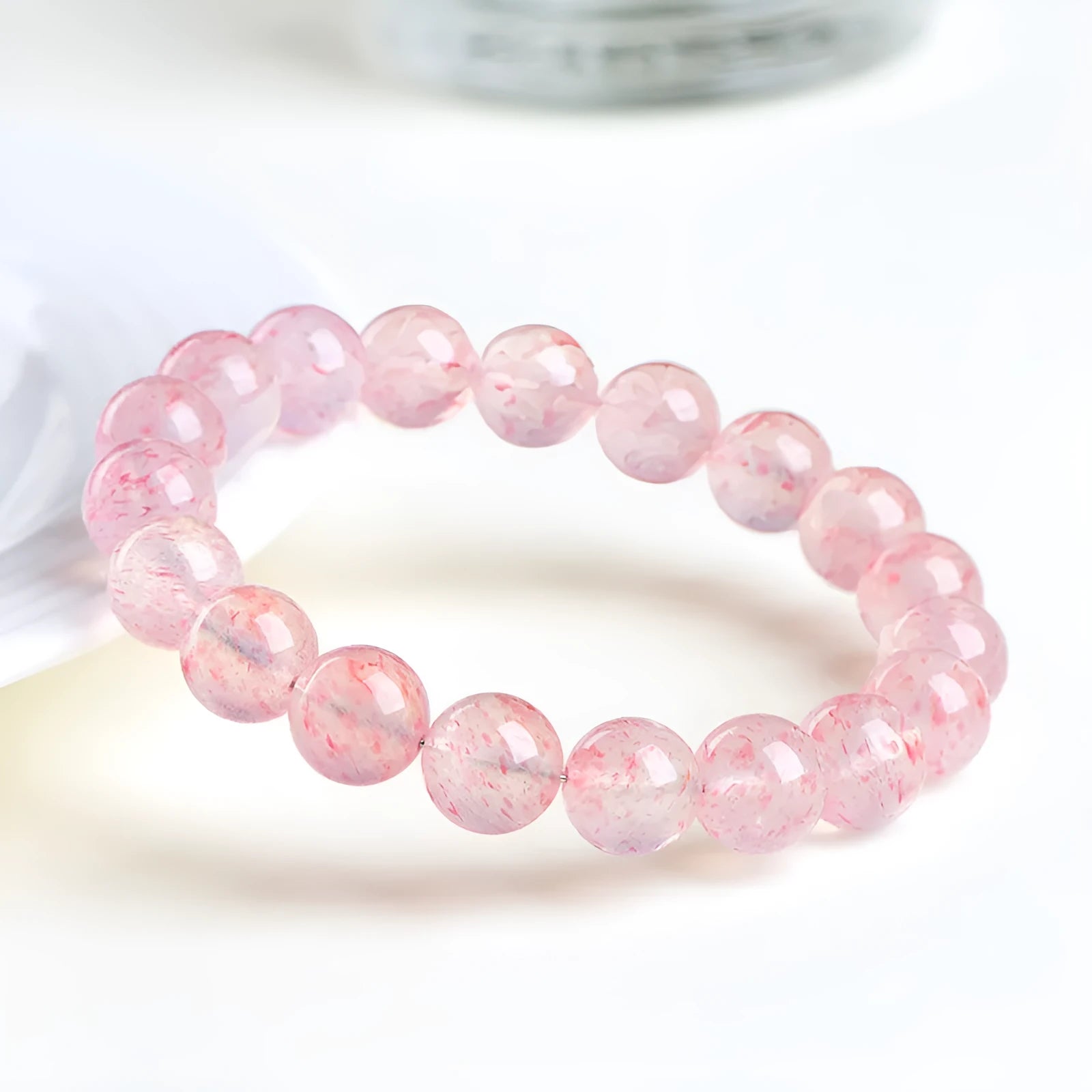Natural white strawberry quartz crystal bracelet with 10-10.8mm polished beads on elastic cord