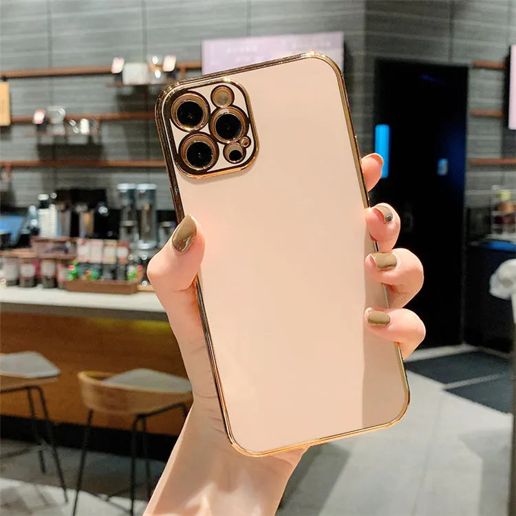 Cartoon style iPhone case with a gold plated cover and silicone stripe accents on a solid coloured TPU background.