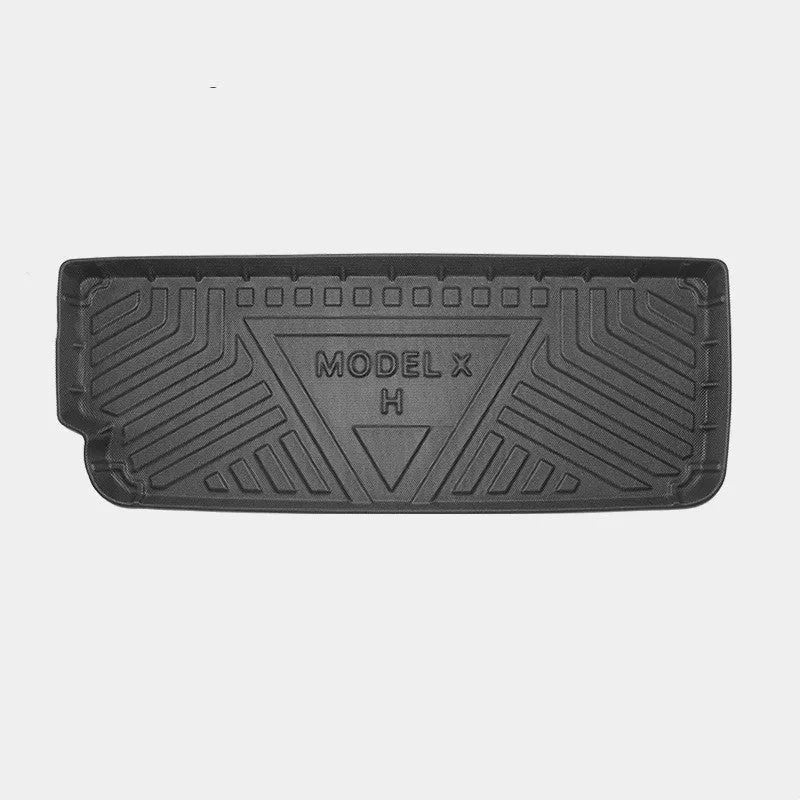 Tesla Model X black TPE rubber floor mats and boot liner set on car interior.