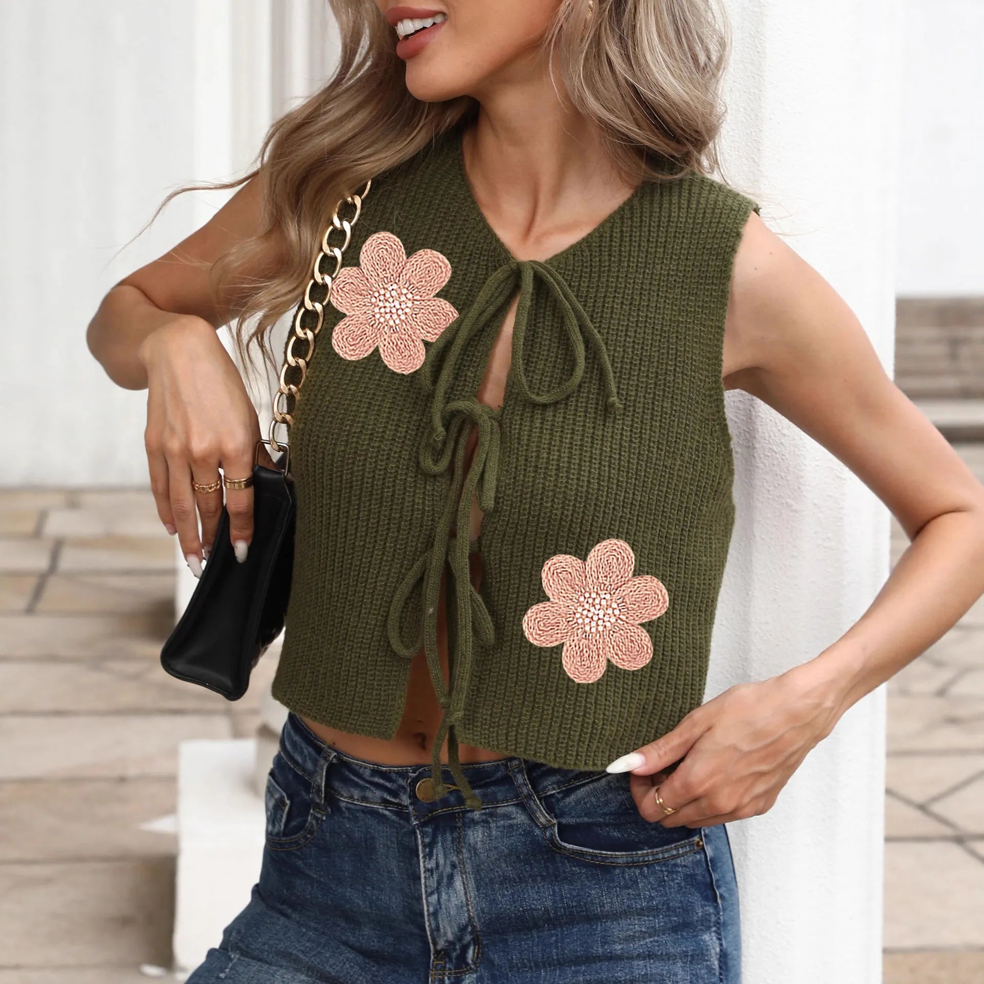 White ladies' sleeveless cardigan vest with lace-up bow, adjustable straps, and apricot flower pattern on deer plush fabric.