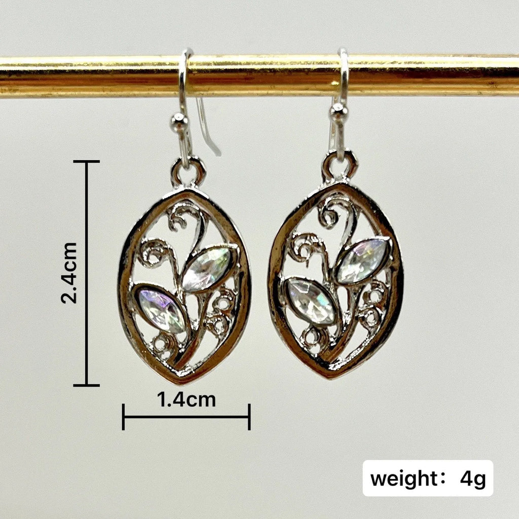 Women's silver colour leaves-shaped earrings with embedded moonstone stones and botanical design