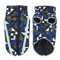 Dog wearing a thick blue geometric pattern reflective shell jacket.