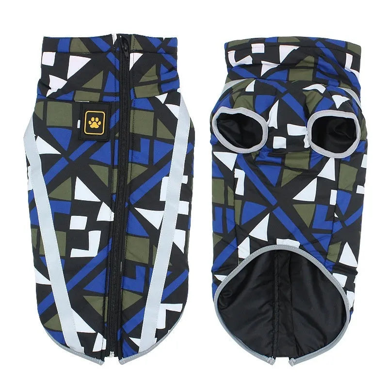 Dog wearing a thick blue geometric pattern reflective shell jacket.