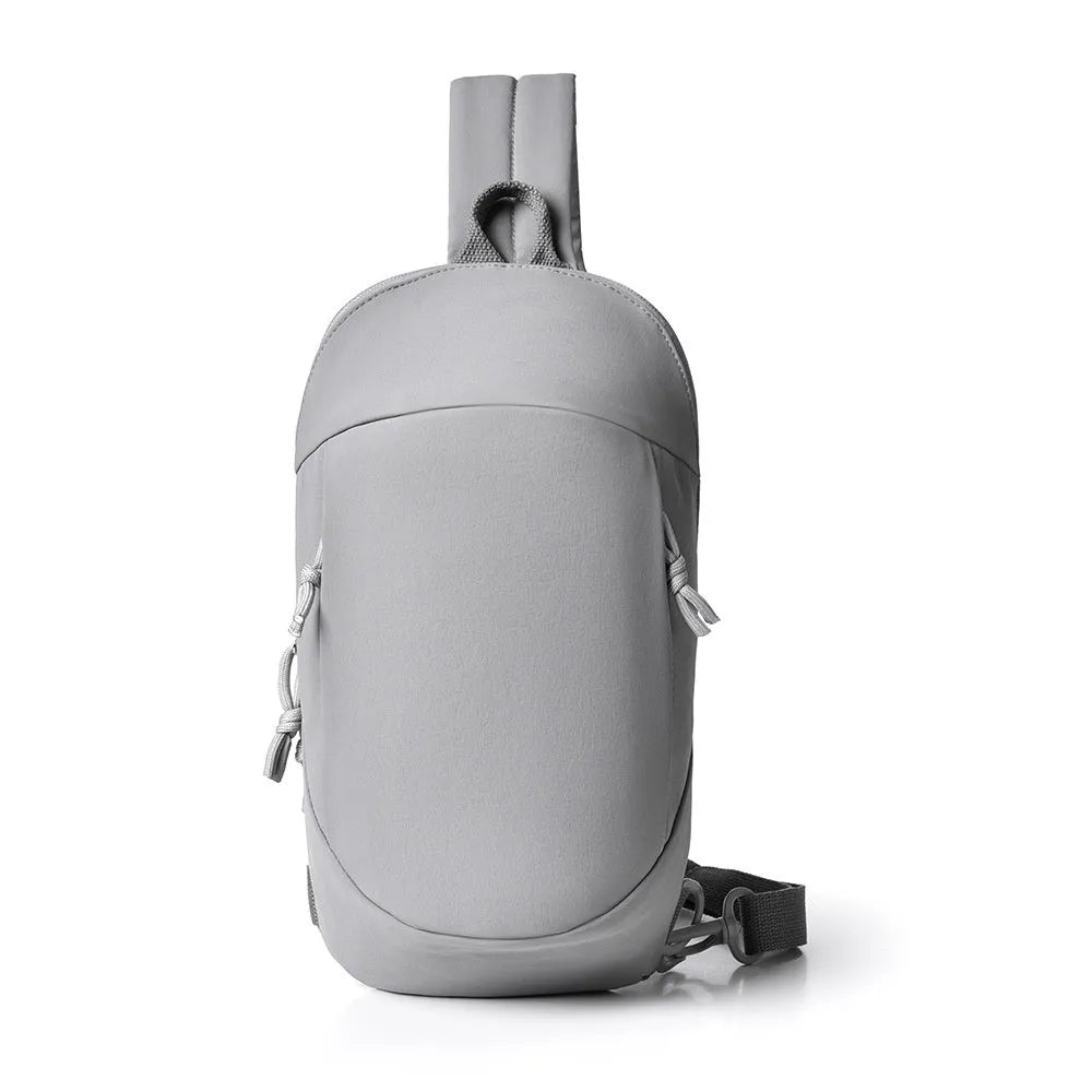 Outdoor crossbody bag in nylon fabric with mobile phone compartment, shown in army green colour