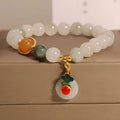 Women's ice jade bracelet with a pearl on the jade buckle.