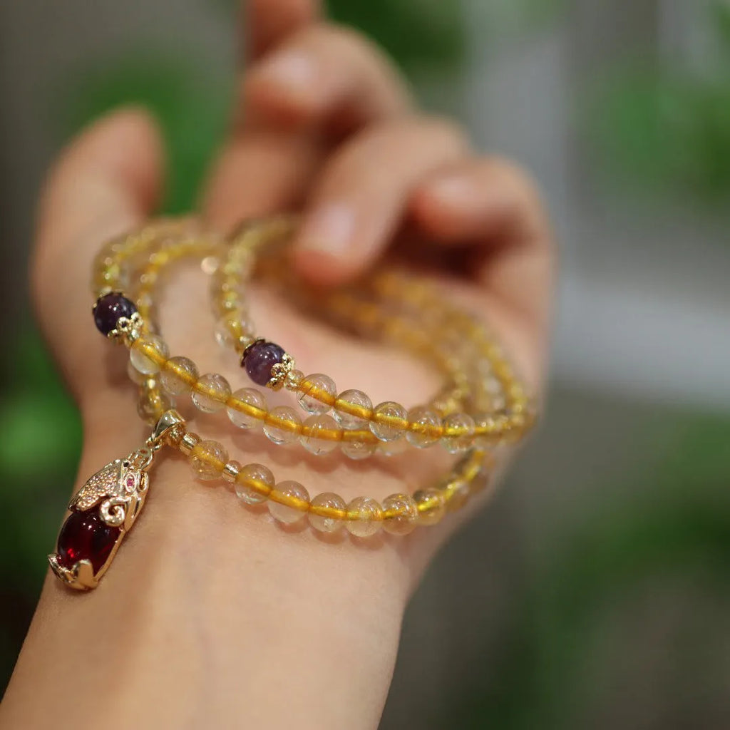 Natural Brazil gold rutilated quartz bracelet with Chinese style design and hanging chopsticks