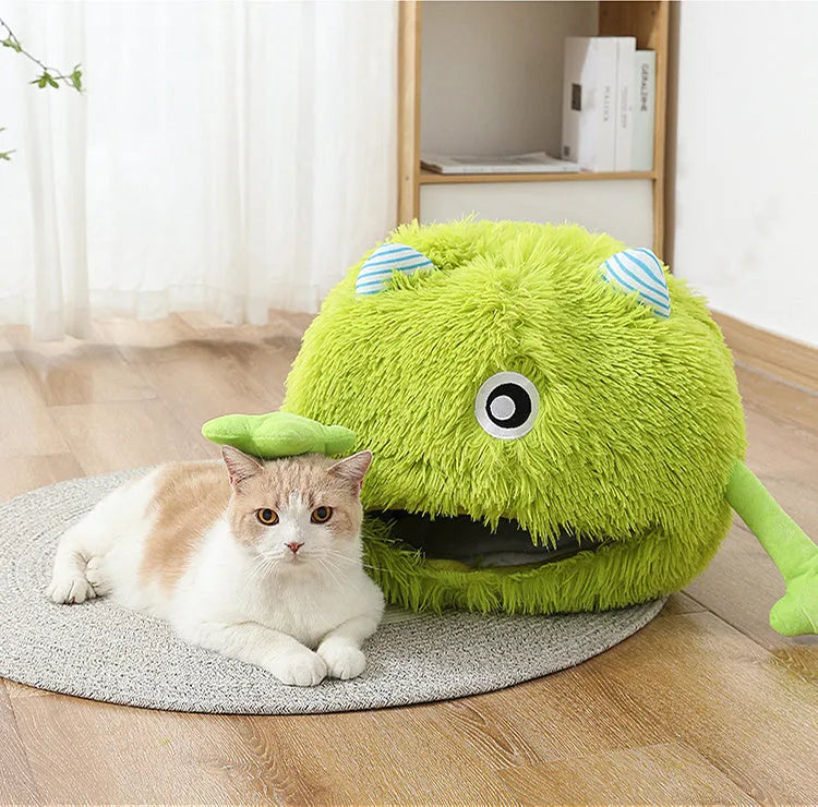 Fluffy round plush pet bed for cats and small dogs on a wooden floor