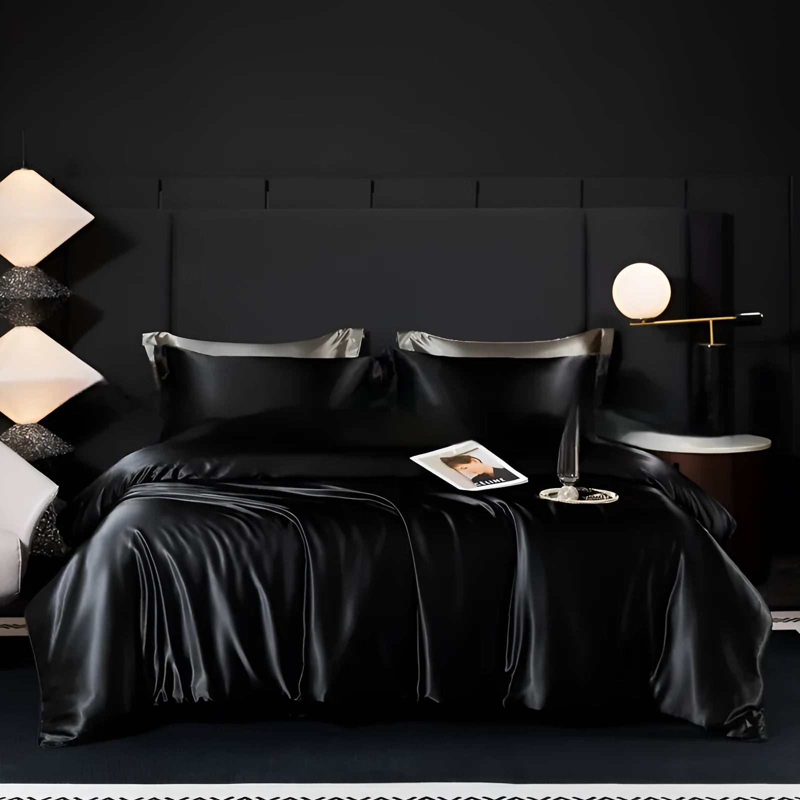 Solid colour silk bedding four-piece set shown in twilight blue on a bed.