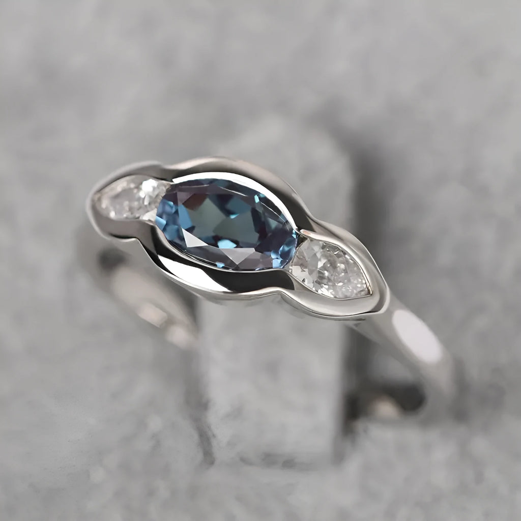 Geometric ellipse women's ring with inlaid zircon stones in Q941 white gold finish