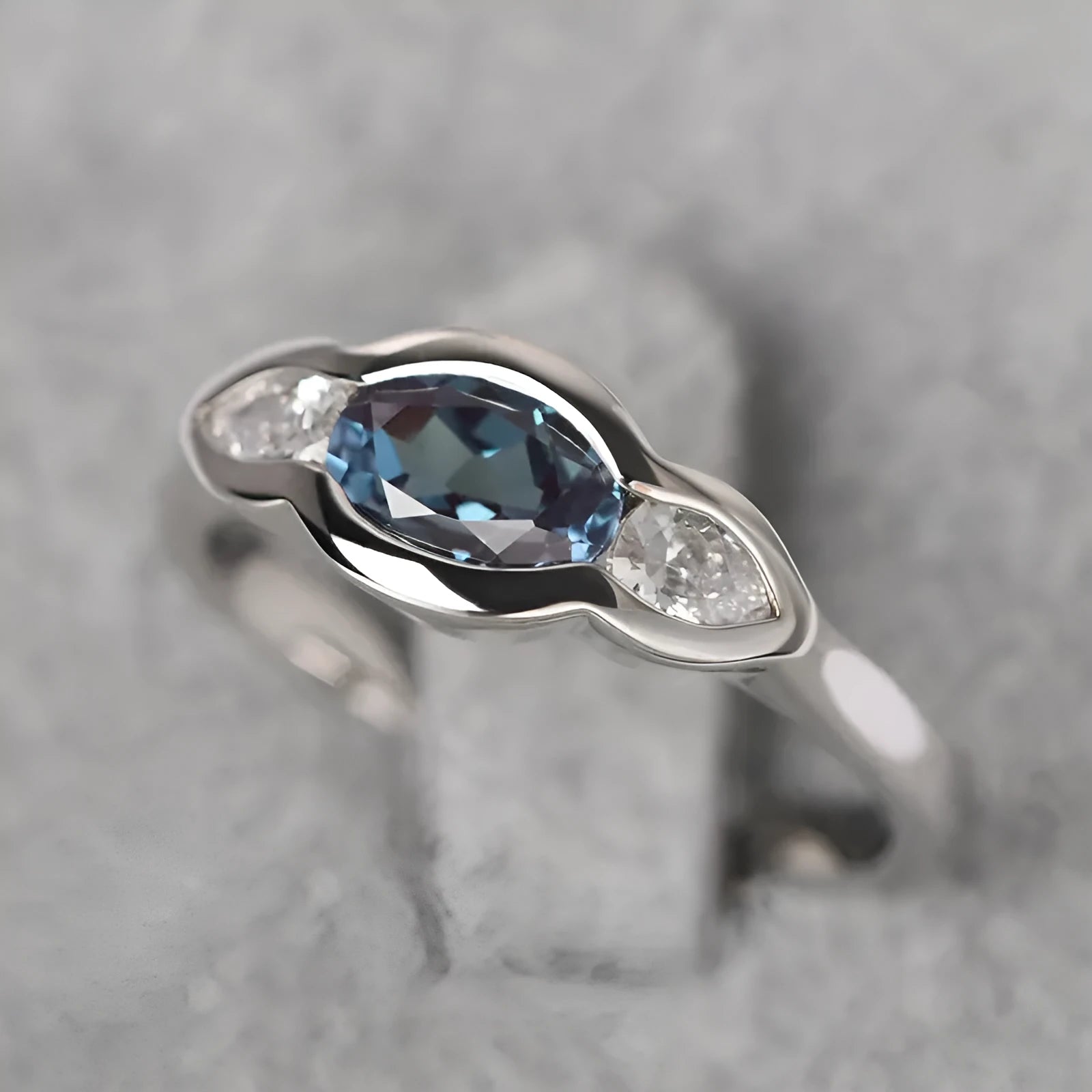 Geometric ellipse women's ring with inlaid zircon stones in Q941 white gold finish