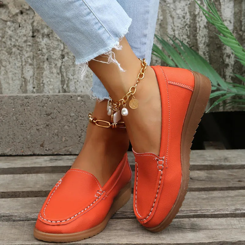 Women's flat loafer shoes in PU leather with a round toe and rubber sole, shown in multiple colours.