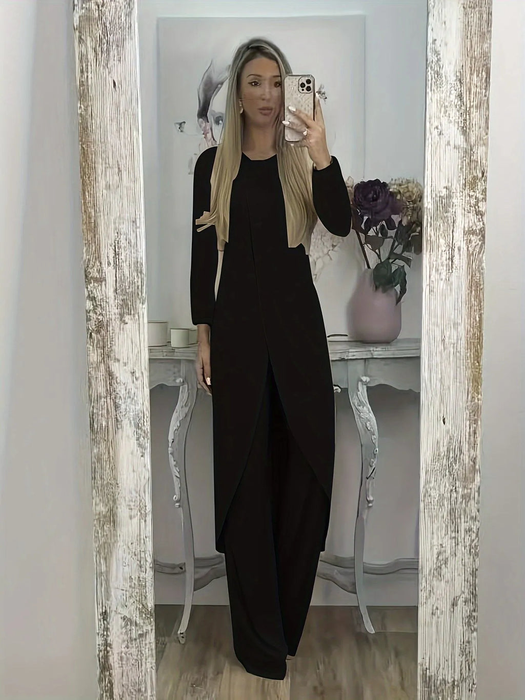 Casual black long sleeve round neck top and loose trousers two-piece lounge wear set.