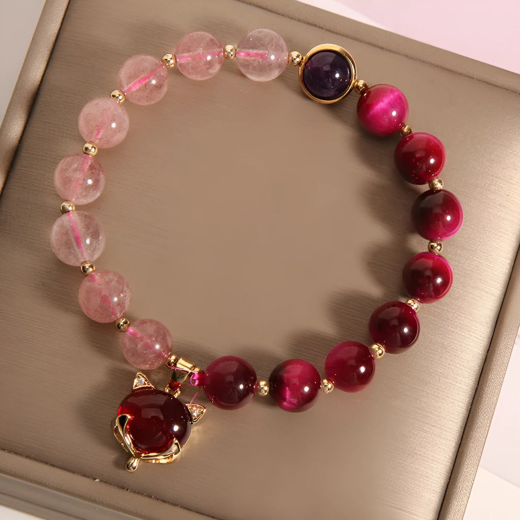 Strawberry crystal elastic bracelet for women on a white background.