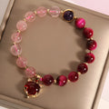 Strawberry crystal elastic bracelet for women on a white background.