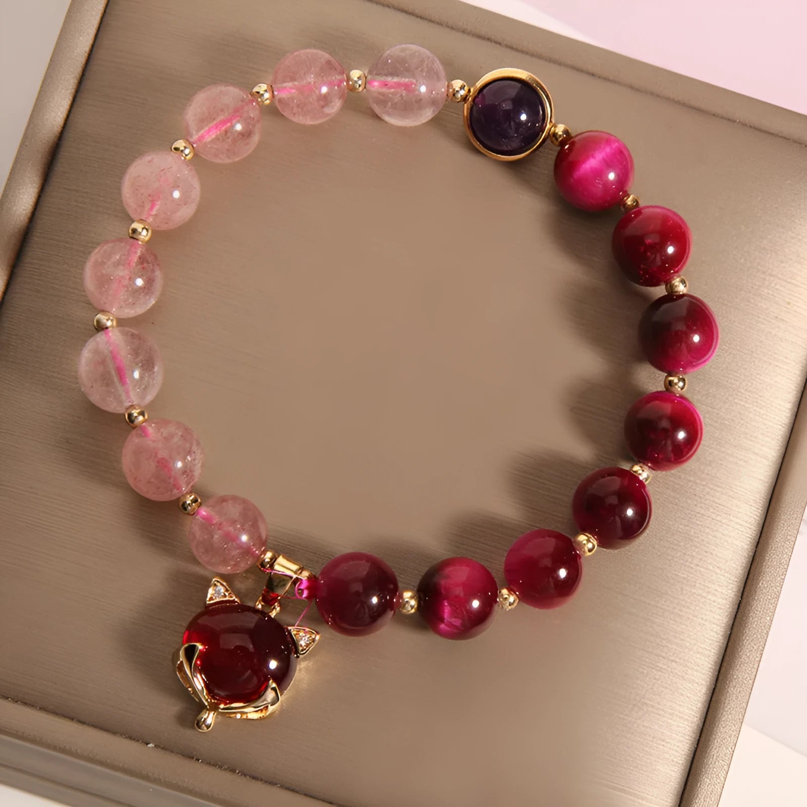 Strawberry crystal elastic bracelet for women on a white background.