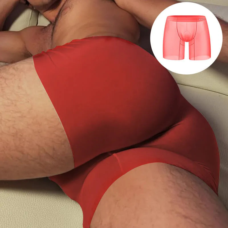 Men's seamless low-waist sports boxer shorts in orange nylon fabric.