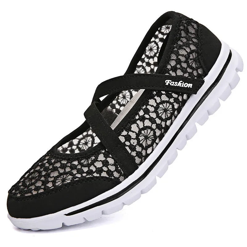 Women's flat casual shoes in beige with mesh upper and round toe, shown from the side.