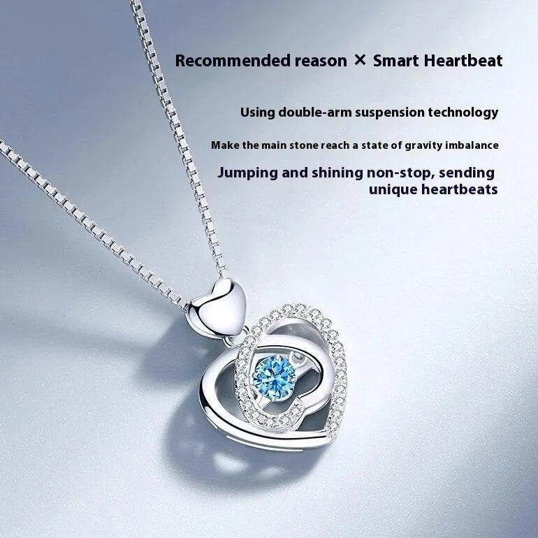 Blue diamond heart necklace and bracelet set with adjustable chain on display